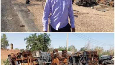 Journalists stand at the scene of ambushes by armed forces, which destroyed militia equipment and equipment