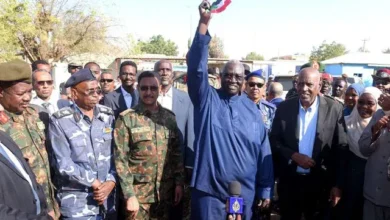 The vice president of the Sovereignty Council rings the bell at Kassala Girls' Secondary School, marking the start of the Sudanese Certificate exams.