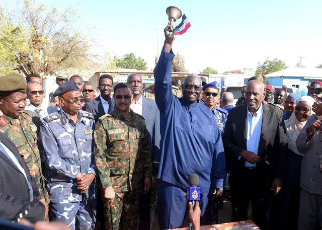 The vice president of the Sovereignty Council rings the bell at Kassala Girls' Secondary School, marking the start of the Sudanese Certificate exams.