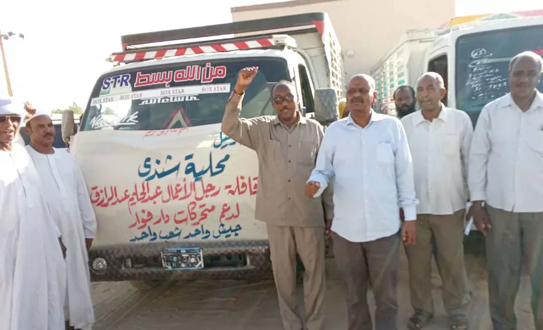 A businessman donates a convoy of four trucks to support Darfur's mobile